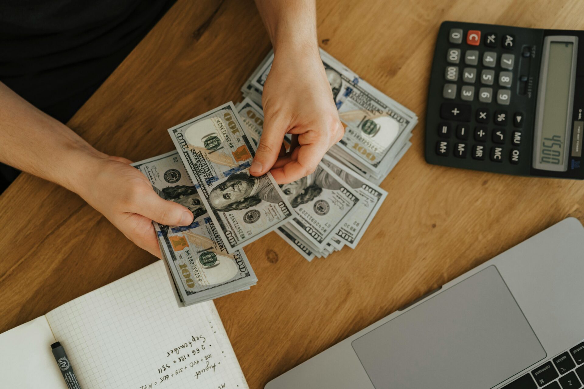 Financial planning scene with cash and calculator tied to credit score needed for business loan